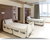 Interior of medical facility, with beds for patients.